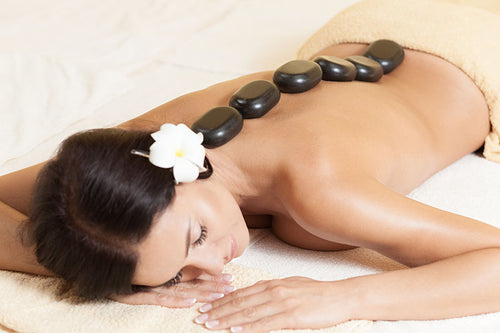 Hot stone massage adds heat to help loosen muscles
